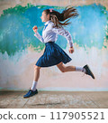 A girl running forward towards her dreams 117905521