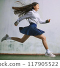 A girl running forward towards her dreams 117905522