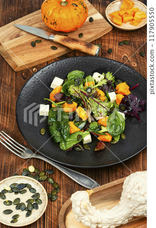 Pumpkin salad with pumpkin seeds. Pumpkin salad with pumpkin seeds. 117905550