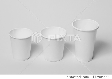 Paper glasses on a light background. 117905562
