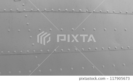 Sheet metal with rivets, aircraft fuselage texture. Sheet metal with rivets, aircraft fuselage texture. 117905673