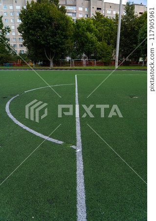 A sweep at the football goal at the school stadium. Football field 117905961