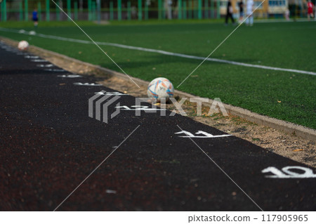 Marking the rubber track of the stadium. Meters on the treadmill. School Stadium Marking the rubber track of the stadium. Meters on the treadmill. School Stadium 117905965