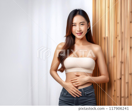 Image of a young woman with her hands on her stomach 117906241