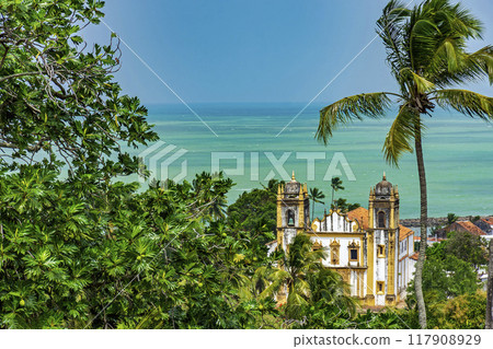 Historic church between vegetation and the sea Historic church between vegetation and the sea 117908929