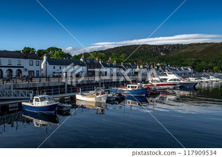 Harbor With Boats In The Village Ullapool At The Atlantic Coast Of The Highlands In Scotland, UK Harbor With Boats In The Village Ullapool At The Atlantic Coast Of The Highlands In Scotland, UK 117909534