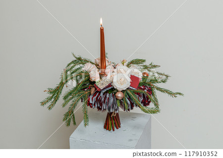 Christmas composition of fresh flowers Christmas composition of fresh flowers 117910352