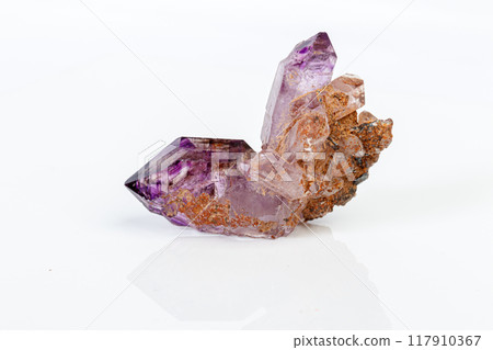 macro mineral stone Amethyst on smoky quartz on a white background macro mineral stone Amethyst on smoky quartz on a white background 117910367