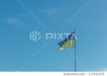 Ukrainian flag against the blue sky Ukrainian flag against the blue sky 117910376