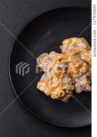 Delicious boiled beef or pork tongue sliced with carrots, onions, sour cream Delicious boiled beef or pork tongue sliced with carrots, onions, sour cream 117910685