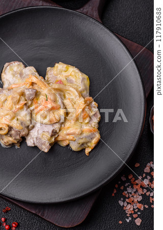 Delicious boiled beef or pork tongue sliced with carrots, onions, sour cream 117910688