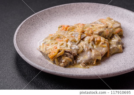 Delicious boiled beef or pork tongue sliced with carrots, onions, sour cream 117910695