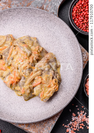 Delicious boiled beef or pork tongue sliced with carrots, onions, sour cream 117910700