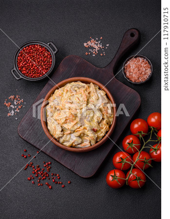 Delicious boiled beef or pork tongue sliced with carrots, onions, sour cream 117910715