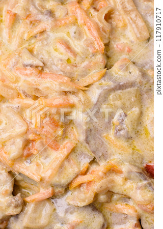 Delicious boiled beef or pork tongue sliced with carrots, onions, sour cream 117910717