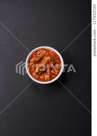 Thai Asian dish with meat, hot pepper, tomato sauce and sesame 117910720