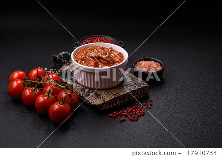 Thai Asian dish with meat, hot pepper, tomato sauce and sesame 117910733