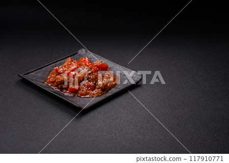 Thai Asian dish with meat, hot pepper, tomato sauce and sesame 117910771