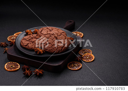 Delicious crispy round oatmeal cookies with chocolate 117910783