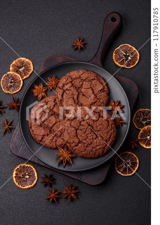 Delicious crispy round oatmeal cookies with chocolate Delicious crispy round oatmeal cookies with chocolate 117910785