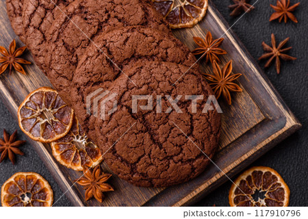 Delicious crispy round oatmeal cookies with chocolate Delicious crispy round oatmeal cookies with chocolate 117910796