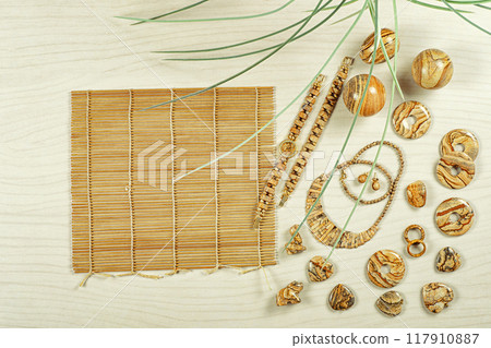 Nature's Palette: Stunning Picture Jasper Jewelry and Bamboo Mat Create Harmonious Flat Lay for Eco-Conscious Fashion Enthusiasts. Nature's Palette: Stunning Picture Jasper Jewelry and Bamboo Mat Create Harmonious Flat Lay for Eco-Conscious Fashion Enthusiasts. 117910887