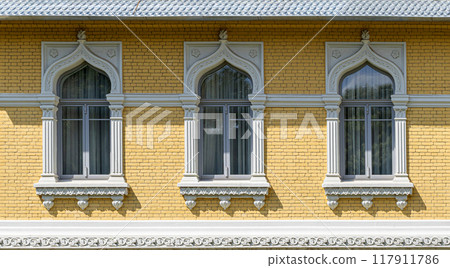 A fragment of a house with windows 117911786