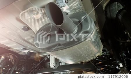 Under car exhaust pipe and suspension. Automotive mufflers. Inspection of car for Defects. Metal fittings and pipes for the muffler. Suspension elements and exhaust system. Auto parts and car service Under car exhaust pipe and suspension. Automotive mufflers. Inspection of car for Defects. Metal fittings and pipes for the muffler. Suspension elements and exhaust system. Auto parts and car service 117912006