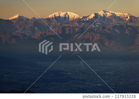 The Southern Alps, Mt. Arakawa, Mt. Akaishi, and Mt. Hijiri seen at sunrise from Minami-Daibosatsu and Okura Takamaru 117913228