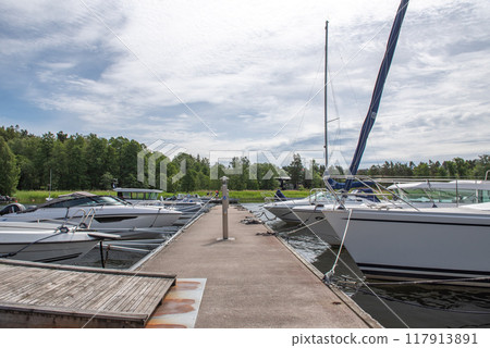 Baltic sea, Sweden. Sailboats moored to a pier 117913891