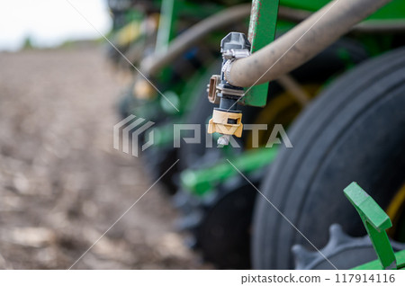 Selective focus on the spay nozzle of a chemical applicator in an agricultural field. Selective focus on the spay nozzle of a chemical applicator in an agricultural field. 117914116