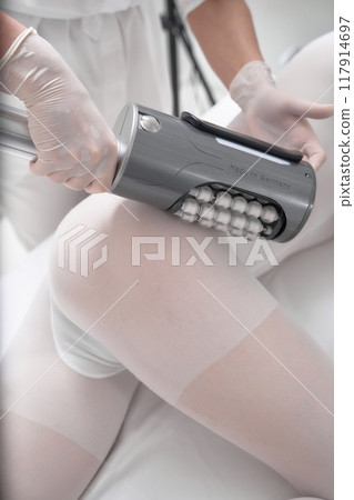 Woman receiving body treatment session in a spa during the afternoon 117914697