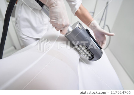 Therapeutic massage treatment at wellness center for muscle relaxation Therapeutic massage treatment at wellness center for muscle relaxation 117914705