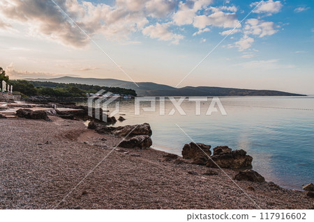 Krk Croatia 27..06.24Seascape with a campsite behind the beach Krk Croatia 27..06.24Seascape with a campsite behind the beach 117916602