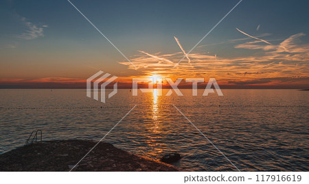 An incredibly beautiful sunset on the beach of the hotel 117916619