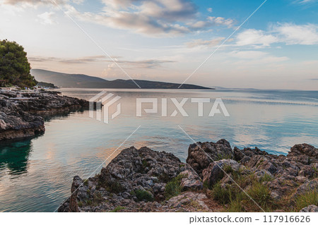 Krk Croatia 27.06.24The stone shore of the bay on the background of the old town Krk Croatia 27.06.24The stone shore of the bay on the background of the old town 117916626