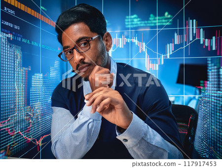Stock trader looking at monitor Stock trader looking at monitor 117917453