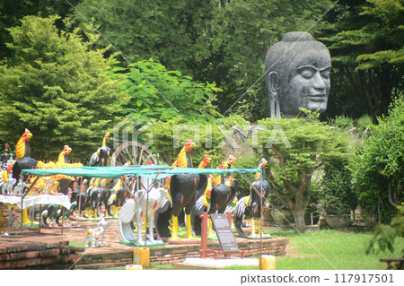 The head of Phra Dhammikarat, which is considered to be the largest and one of the most important bronze Buddha heads in Thailand. Enshrined at Wat Thammickarat. Located in Ayutthaya Historical Park. The head of Phra Dhammikarat, which is considered to be the largest and one of the most important bronze Buddha heads in Thailand. Enshrined at Wat Thammickarat. Located in Ayutthaya Historical Park. 117917501