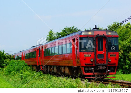 The red-painted Yufu express train runs on the Kyudai Main Line. The red-painted Yufu express train runs on the Kyudai Main Line. 117918437