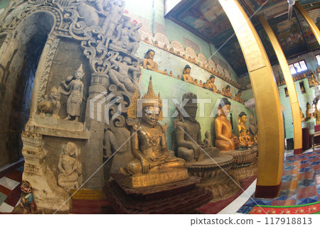 Buddha statue in a tunnel-like balcony with a length of almost 100 meters on each side at Wat Shitetaung Praya. Located at Mrauk-U city in Myanmar. 117918813