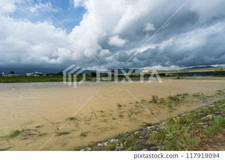 River and sky swollen by the typhoon - Sakawa River during the typhoon River and sky swollen by the typhoon - Sakawa River during the typhoon 117919094