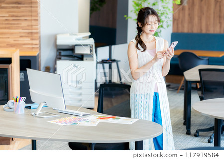 A young lady with a smartphone 117919584
