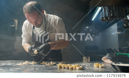 Chef's Ability At Work While Making Cappelletti Pasta Chef's Ability At Work While Making Cappelletti Pasta 117919876