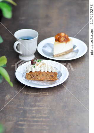carrot cake with cream and walnut topping ,caramel macadamia cheesecake and butterfly pea tea carrot cake with cream and walnut topping ,caramel macadamia cheesecake and butterfly pea tea 117920278