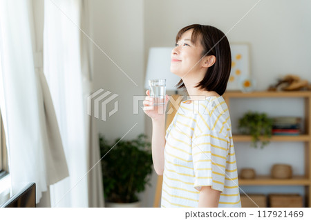 A woman with a cup 117921469