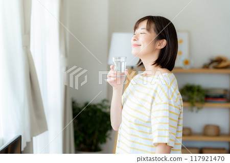 A woman with a cup 117921470