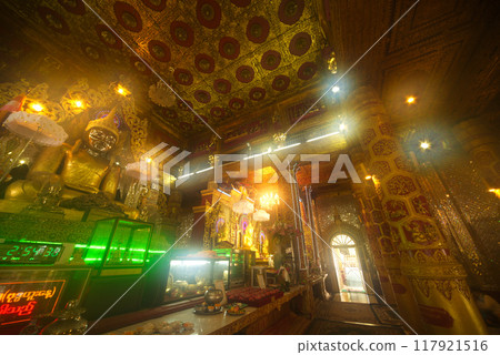 Large golden seated Buddha image is the main Buddha image and Phra Mahamuni in the Mahamuni Phrya Temple Church. It is located on the Rakhine State.Myanmar. Large golden seated Buddha image is the main Buddha image and Phra Mahamuni in the Mahamuni Phrya Temple Church. It is located on the Rakhine State.Myanmar. 117921516