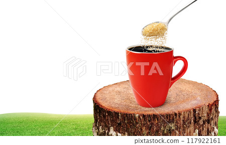 Red coffee mug on natural tree stump. 117922161