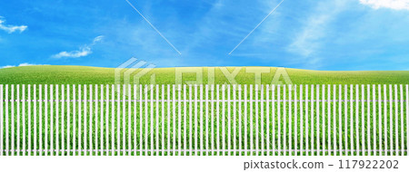 White picket fence, green grass, and a clear sky. White picket fence, green grass, and a clear sky. 117922202