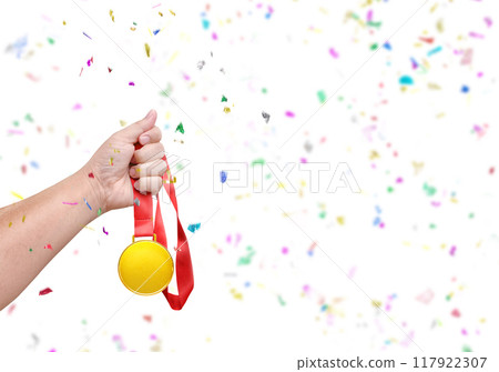 Holding a gold medal  celebrating success 117922307